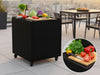 byJEMA udekøkkenbord i sortlakeret stål med hjul på moderne tagterrasse med grøntsager og skærebræt